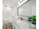 Modern bathroom with granite countertop, vanity, and large mirror at 5101 Thornhill Dr, Gastonia, NC 28052