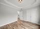 Spacious bedroom with a tray ceiling, hardwood floors, and large closet for ample storage at 5101 Thornhill Dr, Gastonia, NC 28052