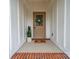 Inviting covered entryway with a decorative wreath, 'HOME' mat, and potted plant accents at 5101 Thornhill Dr, Gastonia, NC 28052