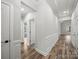 Bright hallway with paneled walls, wood floors, and decorative trim throughout the home at 5101 Thornhill Dr, Gastonia, NC 28052
