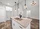Kitchen island with granite countertops, stainless steel appliances, and open access to the living room at 5101 Thornhill Dr, Gastonia, NC 28052