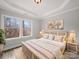 Comfortable main bedroom features a large window, soft lighting, and decorative headboard at 5101 Thornhill Dr, Gastonia, NC 28052
