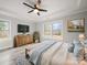 Cozy bedroom with a large bed, dresser, windows, and ceiling fan providing lots of natural light at 5101 Thornhill Dr, Gastonia, NC 28052