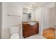 Bright bathroom features granite countertops, wooden cabinets, and modern vessel sink at 525 E Sixth St # 208, Charlotte, NC 28202