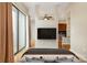 A bedroom features hardwood floors, sliding glass doors, and an adjacent living space at 525 E Sixth St # 208, Charlotte, NC 28202