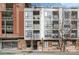Modern building exterior with large windows, balconies, and brick accents at 525 E Sixth St # 208, Charlotte, NC 28202
