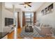 Bright living room with hardwood floors, a large window, modern furnishings, and high ceilings at 525 E Sixth St # 208, Charlotte, NC 28202