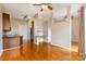 An open-concept living room features hardwood floors and space for dining and lounging at 525 E Sixth St # 208, Charlotte, NC 28202