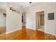 The living space features hardwood floors, an adjacent kitchen, and a bathroom at 525 E Sixth St # 208, Charlotte, NC 28202