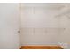 A walk-in closet has hardwood floors and wire shelving for ample storage at 525 E Sixth St # 208, Charlotte, NC 28202