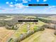 Aerial view of a property with a well maintained lawn with surrounding greenery, located a short distance from Downtown Monroe at 5405 Austin Rd, Monroe, NC 28112