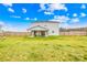 Spacious backyard with a covered patio and fenced perimeter, perfect for outdoor living at 5405 Austin Rd, Monroe, NC 28112