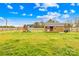 View of the backyard with a playground and a storage shed at 5405 Austin Rd, Monroe, NC 28112