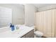Bright bathroom features a white vanity, modern fixtures, and a shower with a curtain at 5405 Austin Rd, Monroe, NC 28112