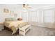 Comfortable bedroom features neutral carpet, ceiling fan, and natural light-filled windows at 5405 Austin Rd, Monroe, NC 28112