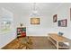Bright dining room with natural light, a modern chandelier, and elegant wainscoting detail at 5405 Austin Rd, Monroe, NC 28112