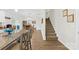 Open-concept dining area featuring chairs, a wooden table, and adjacent staircase at 5405 Austin Rd, Monroe, NC 28112