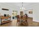 Open-concept dining area with backyard view, wooden table, and chairs connects with the living spaces at 5405 Austin Rd, Monroe, NC 28112