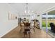 Inviting dining area with open floorplan into kitchen, modern lighting and access to backyard patio at 5405 Austin Rd, Monroe, NC 28112