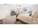 Bright main bedroom showcases natural light, carpeted floor, ceiling fan, and decorative wall art at 5405 Austin Rd, Monroe, NC 28112