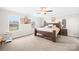 Spacious main bedroom features carpeted floors, ceiling fan, and large windows for natural light at 5405 Austin Rd, Monroe, NC 28112