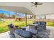 Cozy outdoor patio featuring comfortable seating, a fire pit, and a view of the spacious backyard and shed at 5405 Austin Rd, Monroe, NC 28112