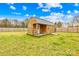 Charming wooden storage shed with a metal roof in a fenced backyard providing secure storage at 5405 Austin Rd, Monroe, NC 28112