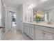 Bright bathroom with double vanity, walk-in closet, and tile floors at 5585 Zeeland Ln, Fort Mill, SC 29707