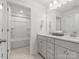 Bathroom with a double vanity, modern fixtures, and a door leading to the shower and toilet at 5585 Zeeland Ln, Fort Mill, SC 29707
