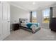 Cozy bedroom with neutral carpet, windows, and furniture at 5585 Zeeland Ln, Fort Mill, SC 29707