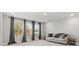 Bright bedroom featuring large windows, modern curtains, and a cozy sofa with stylish side tables at 5585 Zeeland Ln, Fort Mill, SC 29707