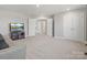 Spacious bedroom with large closets, a TV, and neutral carpeting, perfect for relaxation and storage at 5585 Zeeland Ln, Fort Mill, SC 29707