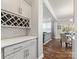 Butler pantry with custom cabinetry, wine rack, and granite countertop at 5585 Zeeland Ln, Fort Mill, SC 29707