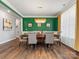 Spacious dining room with modern lighting, hardwood flooring, and views to other living spaces at 5585 Zeeland Ln, Fort Mill, SC 29707