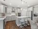 Bright kitchen featuring stainless appliances, an island with bar seating, and white cabinets at 5585 Zeeland Ln, Fort Mill, SC 29707