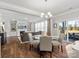 Open-concept living space features a cozy living room and dining area with hardwood floors at 5585 Zeeland Ln, Fort Mill, SC 29707