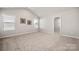 Bedroom offers carpeted floors, two windows for natural light, and decor at 6015 Ahoskie Dr, Charlotte, NC 28215