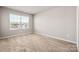 Neutral bedroom with wall to wall carpet and a window at 6015 Ahoskie Dr, Charlotte, NC 28215