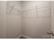Neutral walk-in closet with wall to wall carpet and wire shelving at 6015 Ahoskie Dr, Charlotte, NC 28215