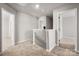 Hallway featuring carpeted floors, an open doorway, and natural light at 6015 Ahoskie Dr, Charlotte, NC 28215