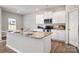 Modern kitchen featuring white cabinets, granite countertops, and stainless steel appliances at 6015 Ahoskie Dr, Charlotte, NC 28215