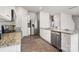 Open kitchen featuring stainless steel appliances, white cabinets, and a convenient layout at 6015 Ahoskie Dr, Charlotte, NC 28215