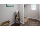 Laundry room with laundry decor, a shelf, and wood-look flooring at 6015 Ahoskie Dr, Charlotte, NC 28215