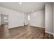 Spacious living room featuring hardwood floors and an open layout at 6015 Ahoskie Dr, Charlotte, NC 28215