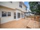 Spacious back deck featuring a pergola and direct access into the house at 6027 Edinmeadow Ln # 29, Charlotte, NC 28269