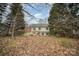 View of a large home with deck, set amongst the trees in a natural surrounding at 6027 Edinmeadow Ln # 29, Charlotte, NC 28269