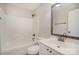 Bathroom with a single sink vanity, a large mirror, and a shower-tub combo at 6027 Edinmeadow Ln # 29, Charlotte, NC 28269