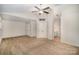 Spacious bedroom with plush carpet, ceiling fan, and ensuite bathroom access at 6027 Edinmeadow Ln # 29, Charlotte, NC 28269