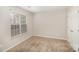 Bedroom with neutral walls and carpet with a window letting in natural light at 6027 Edinmeadow Ln # 29, Charlotte, NC 28269
