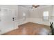 Welcoming entryway with hardwood floors, wainscoting, and a ceiling fan at 6027 Edinmeadow Ln # 29, Charlotte, NC 28269